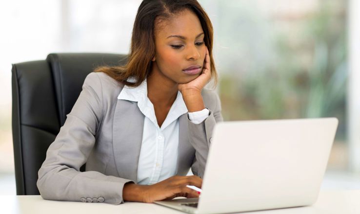 Sad woman at a laptop