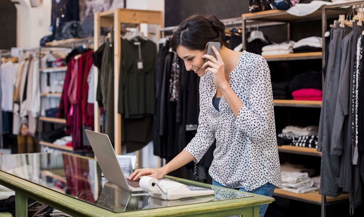 Retail worker on a laptop