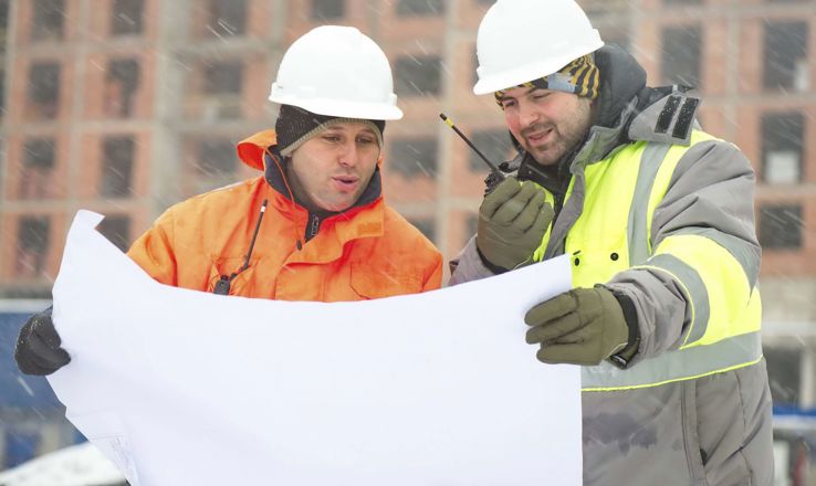 Construction Workers looking over plans