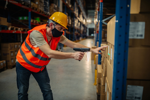 man stocking warehouse