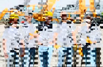 Group of happy construction workers on a job site