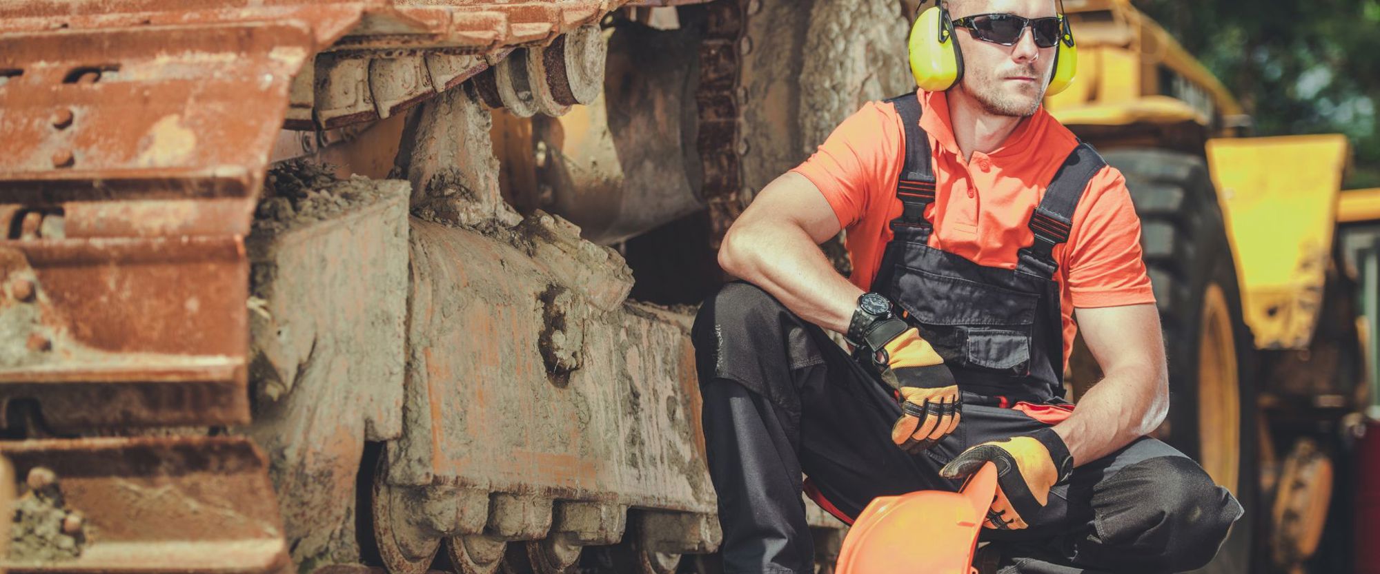 Man wearing construction hat in construction zone
