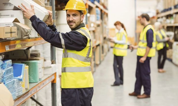 Warehouse workers putting away boxes