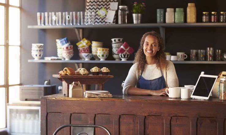 Happy cashier in a cafe